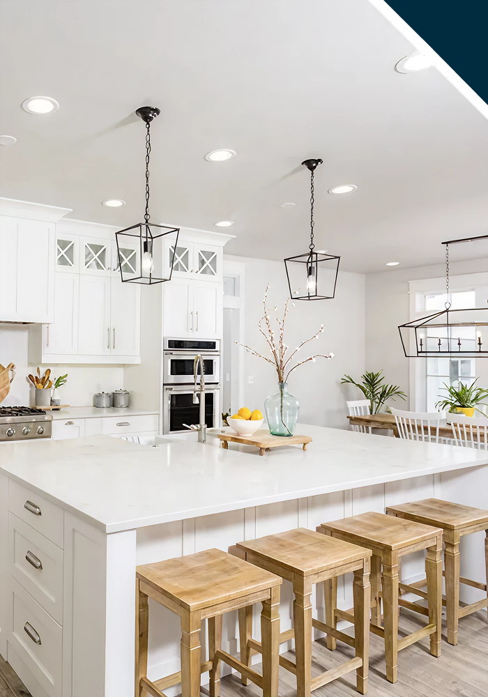 Modern white kitchen with wooden stools